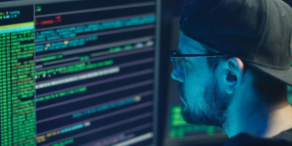 Marketer quietly exploring lesser-known hidden martech tools on a laptop